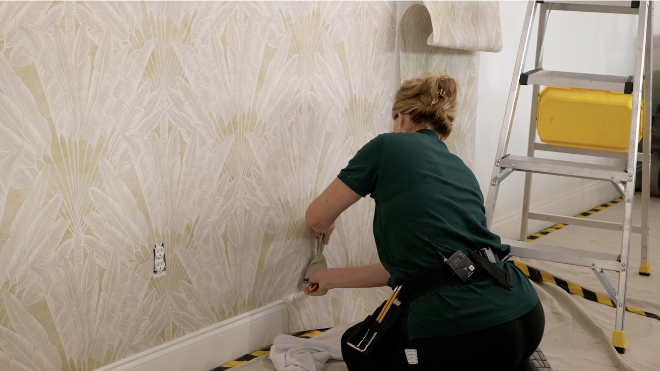 Professional wallpaper installation in progress